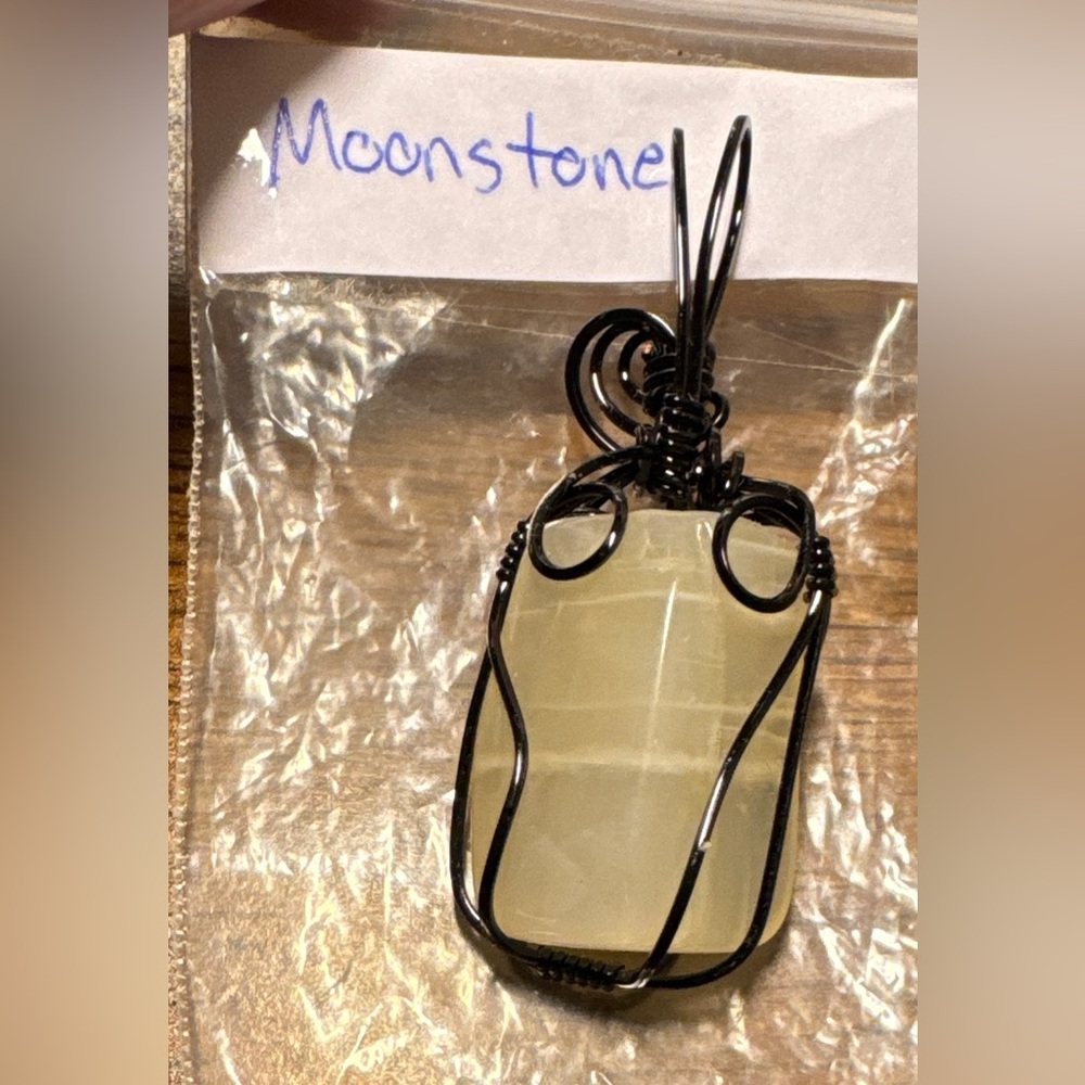 Beautiful Moonstone pendant in a black wrap (jewelers grade wire)